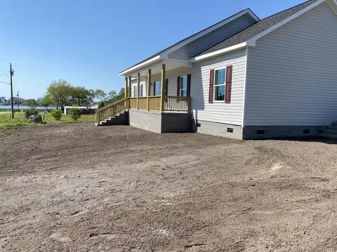 Waterfront yard graded out and shaped to the house — Coastal Clearing & Debris, Brunswick County NC